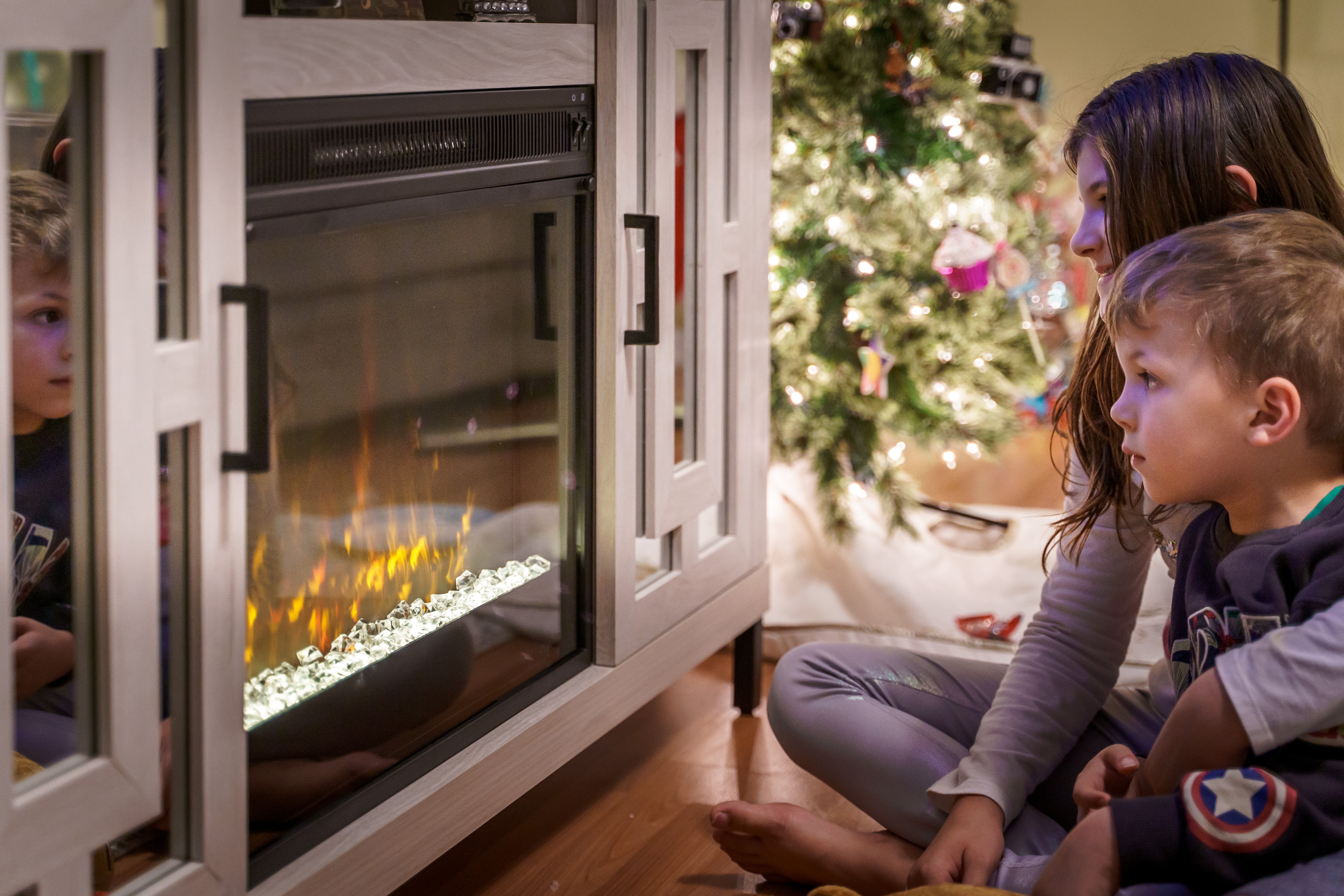 Children in front of fireplace